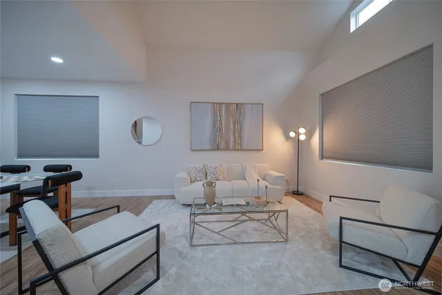 a living room with furniture and a lamp