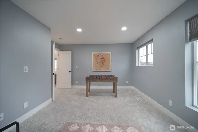 a bedroom with a bed and a lamp on table