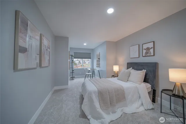 a bedroom with a bed and lamp lamp