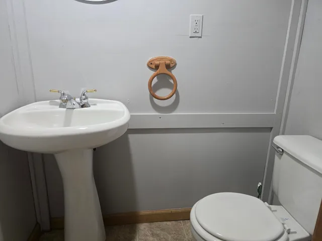 a bathroom with a sink a toilet