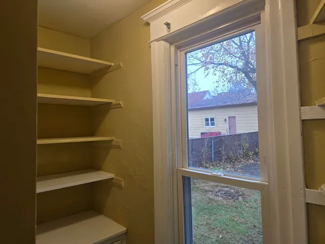 a room with table and a window