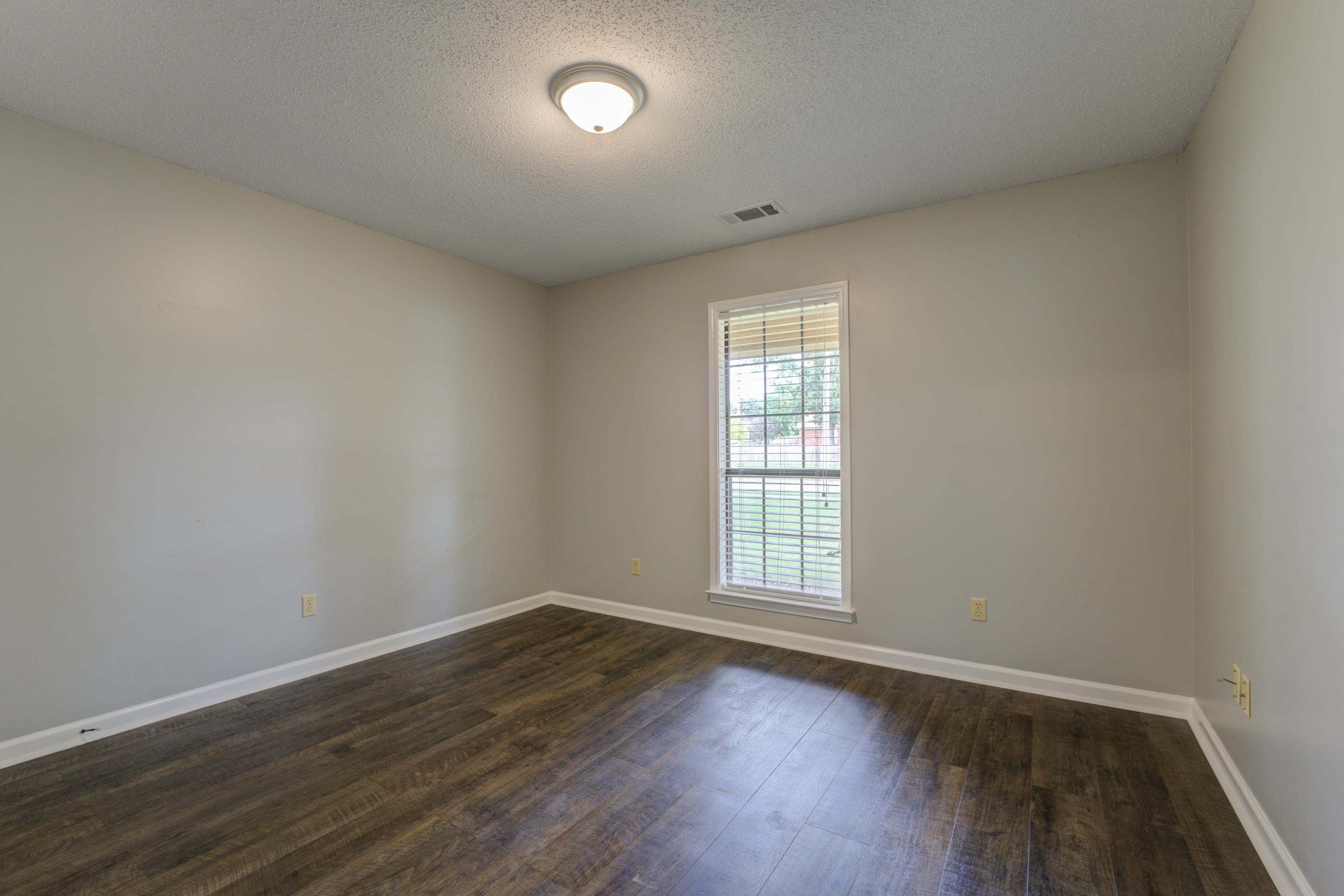 6387 St Elmo Road Bartlett, TN 38135 - Photo 18 of 30 Have sweet dreams in the second bedroom with wood floors and a closet.
