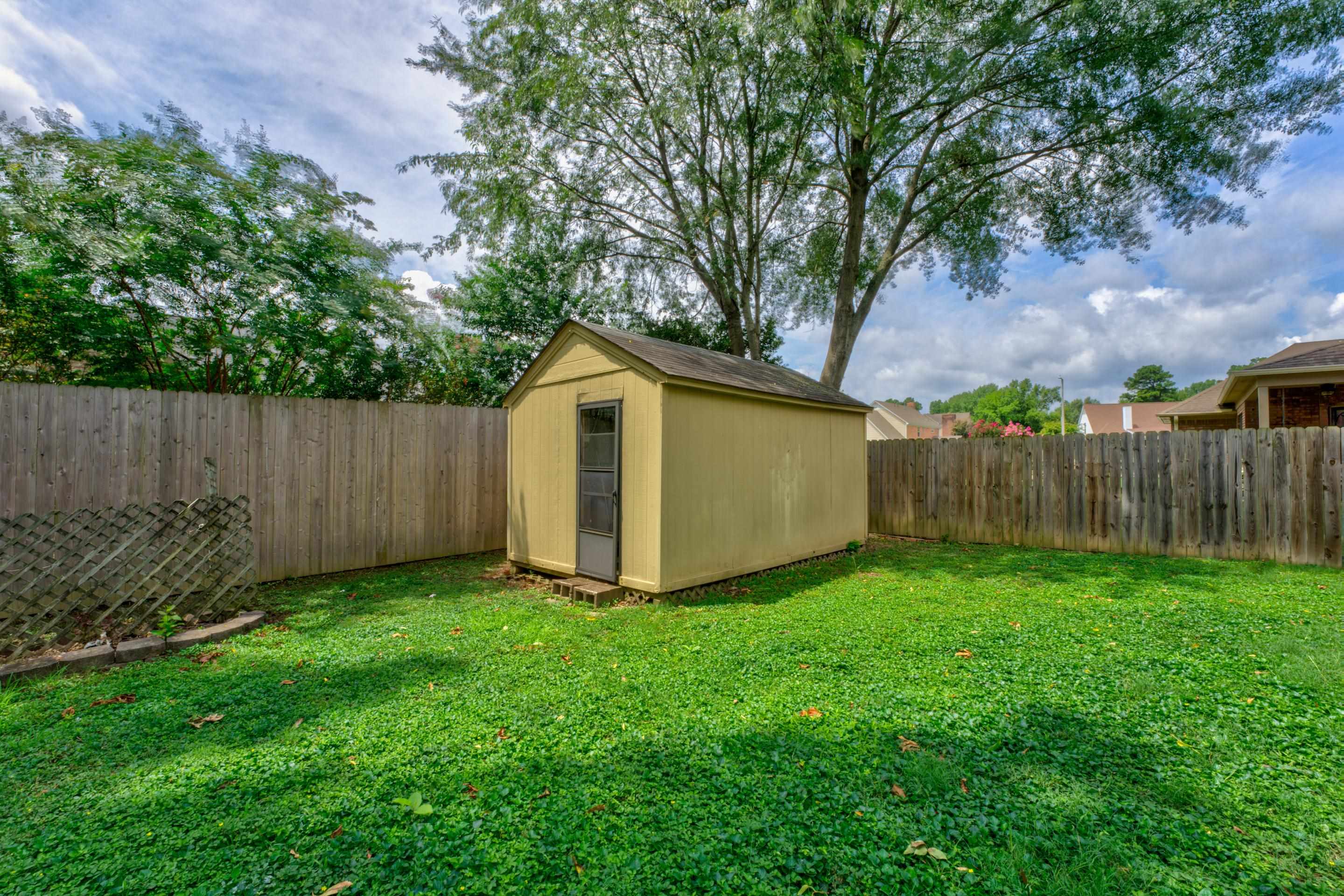 6387 St Elmo Road Bartlett, TN 38135 - Photo 24 of 30 View of the yard with a nice storage shed.