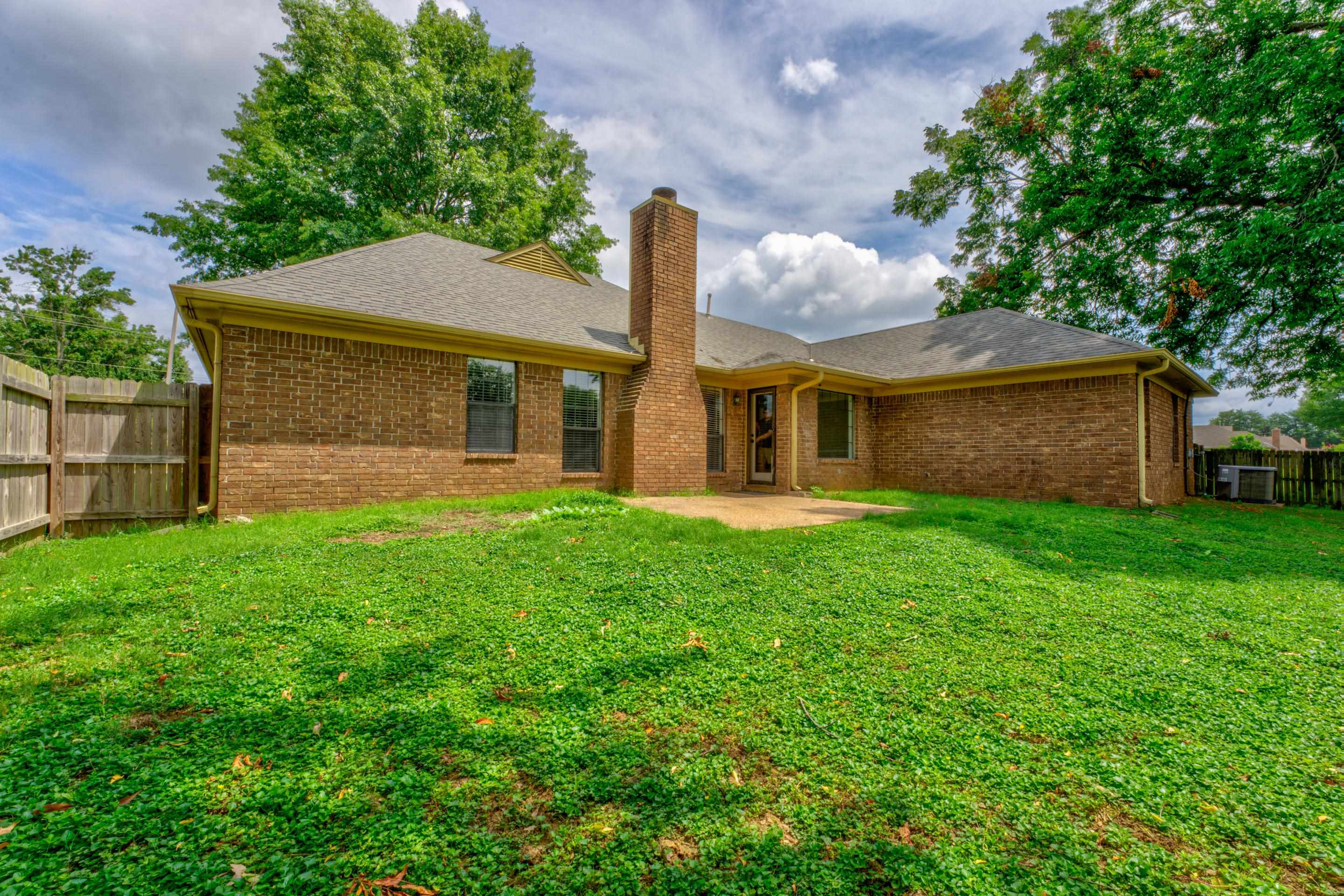 6387 St Elmo Road Bartlett, TN 38135 - Photo 27 of 30 The fenced backyard comes complete with a delightful patio and storage shed.