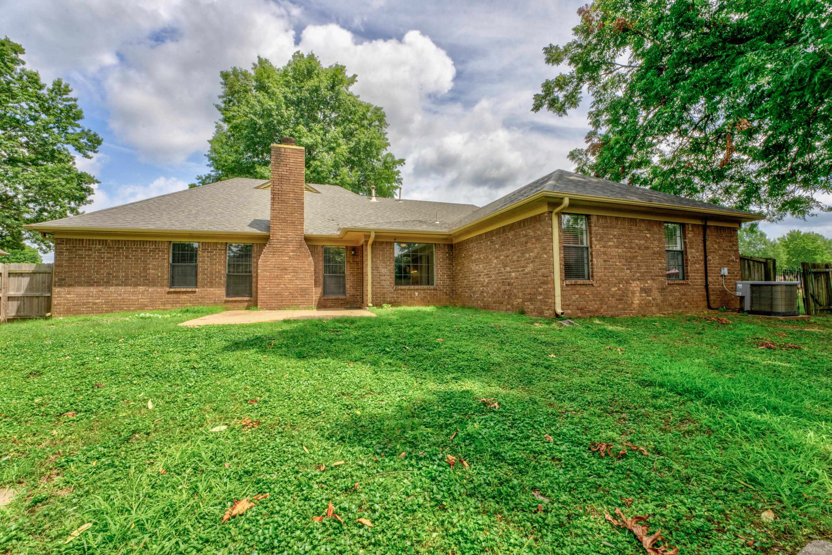 6387 St Elmo Road Bartlett, TN 38135 - Photo 28 of 30 The fenced backyard has a patio perfect for cookouts and parties.
