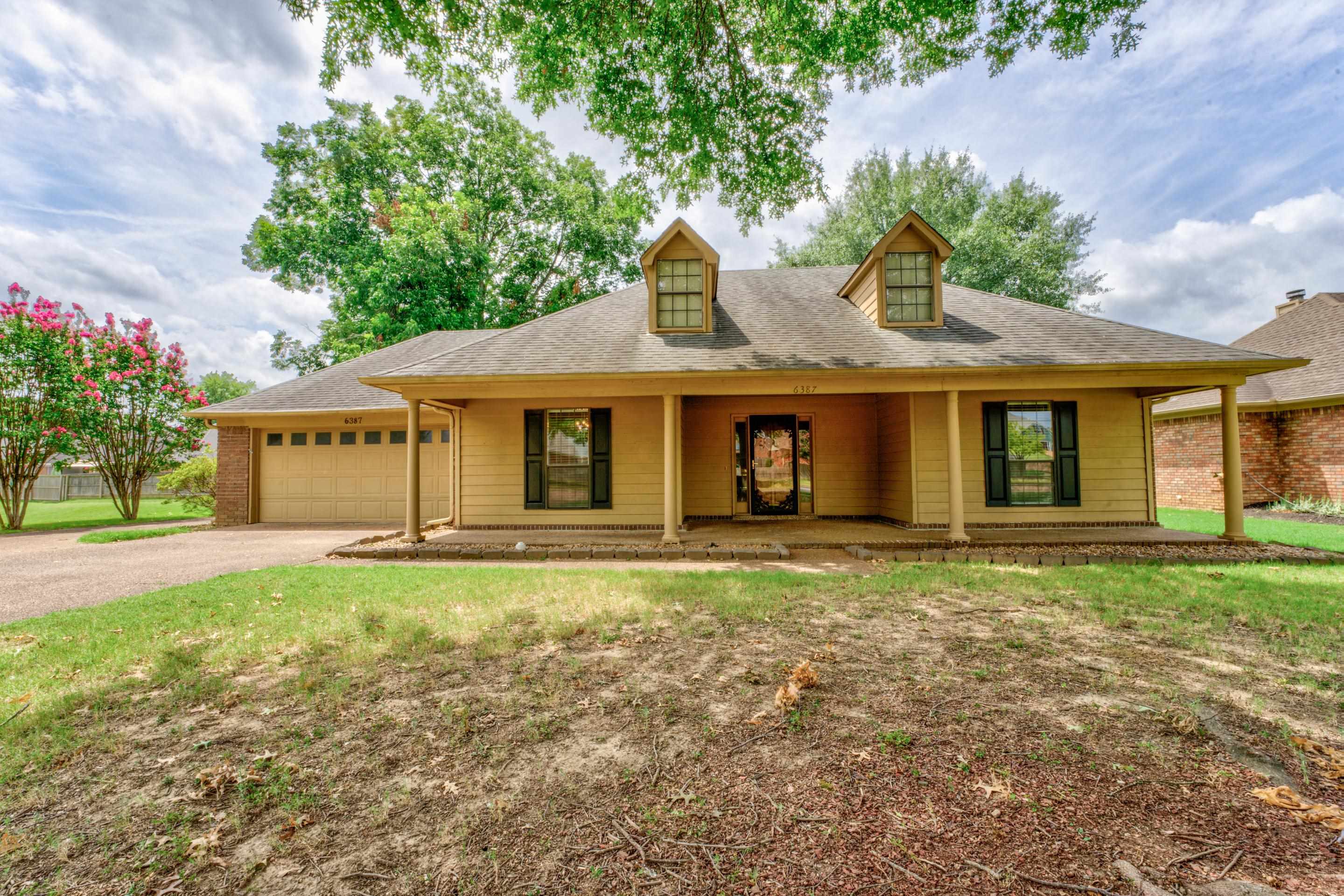 6387 St Elmo Road Bartlett, TN 38135 - Photo 29 of 30 View of front facade featuring a charming covered porch and a garage.