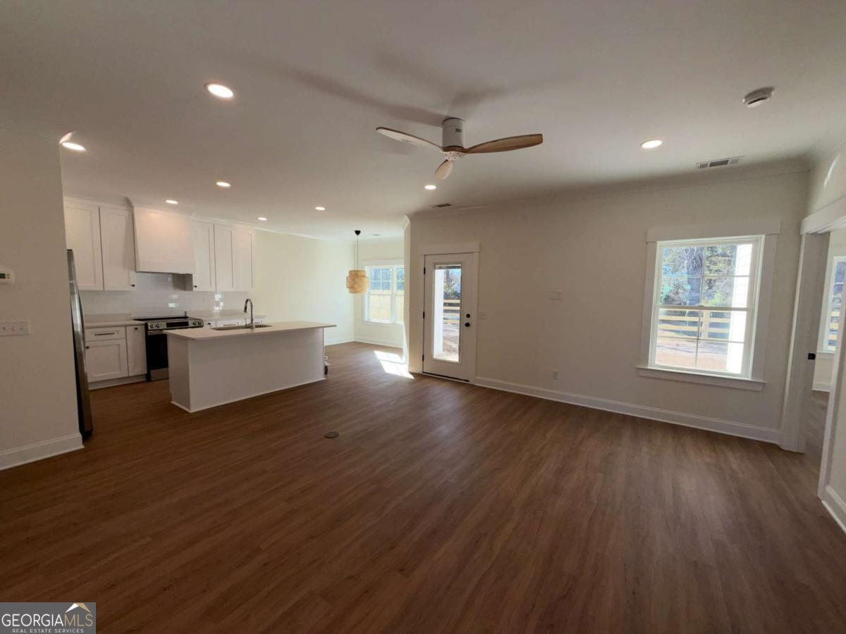 350 Rucker Lane, Unit B Statesboro, GA 30458 - Photo 3 of 20 a view of kitchen with wooden floor and electronic appliances