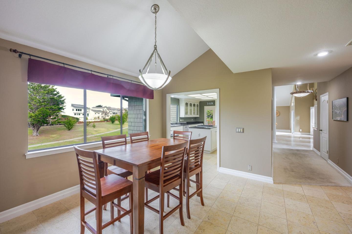 15 Ashdown Place Half Moon Bay, CA 94019 - Photo 15 of 53 a dining room with furniture a chandelier and wooden floor