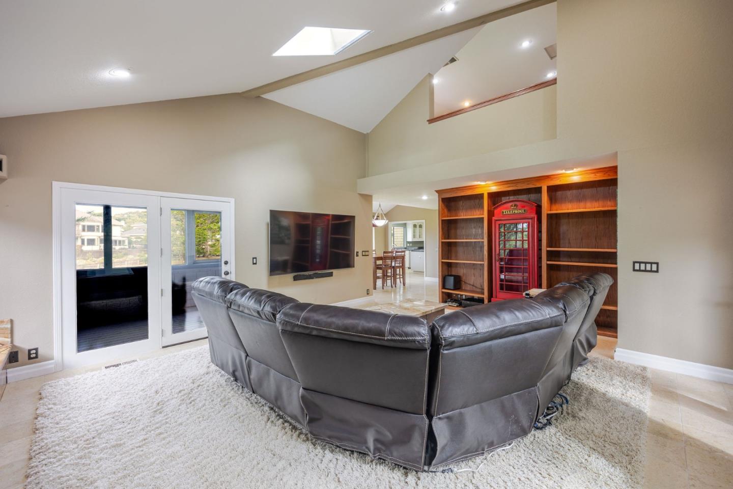 15 Ashdown Place Half Moon Bay, CA 94019 - Photo 18 of 53 a living room with furniture and a flat screen tv