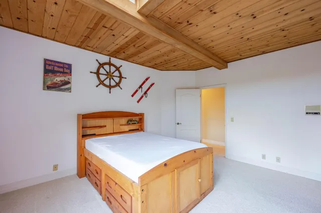 a bathroom with a granite countertop sink and a large mirror