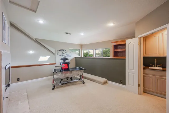 a kitchen with a refrigerator and cabinets