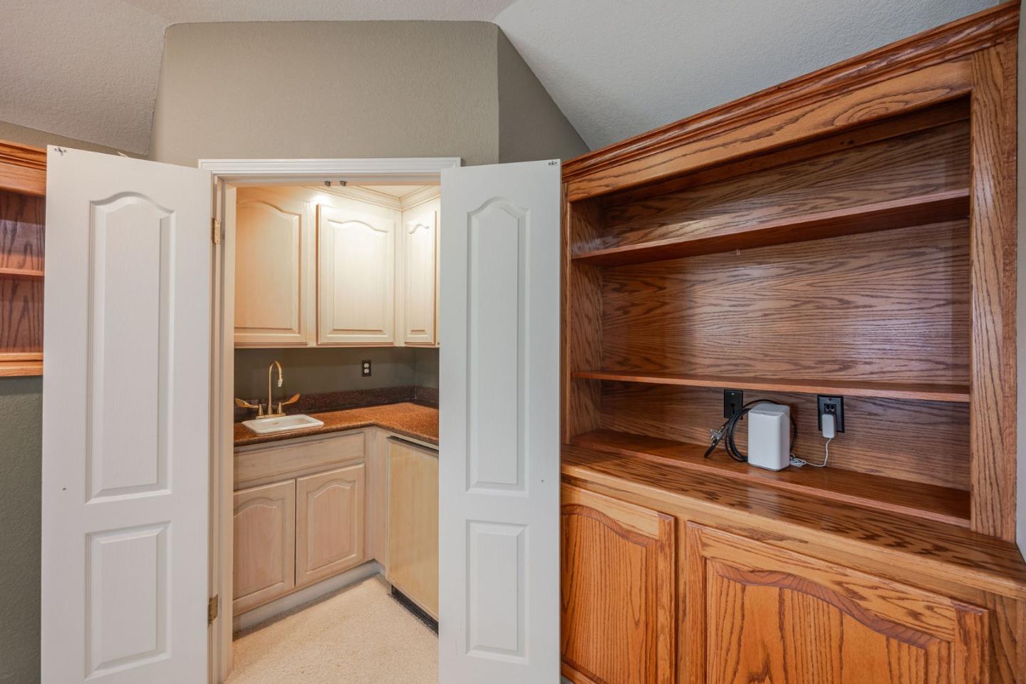 15 Ashdown Place Half Moon Bay, CA 94019 - Photo 32 of 53 a kitchen with a refrigerator and cabinets