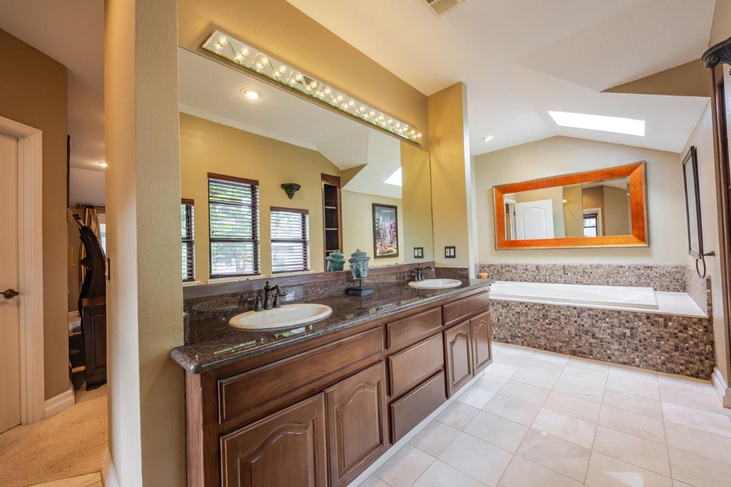 15 Ashdown Place Half Moon Bay, CA 94019 - Photo 38 of 53 a spacious bathroom with a granite countertop sink mirror and bathtub