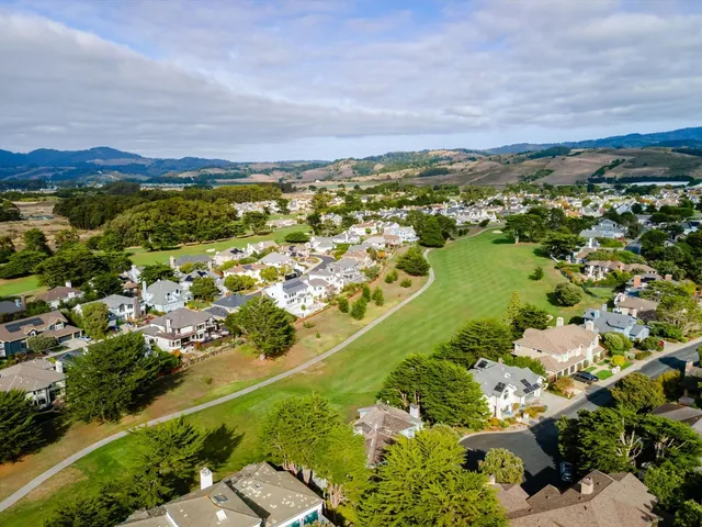 an aerial view of a house with garden and plants