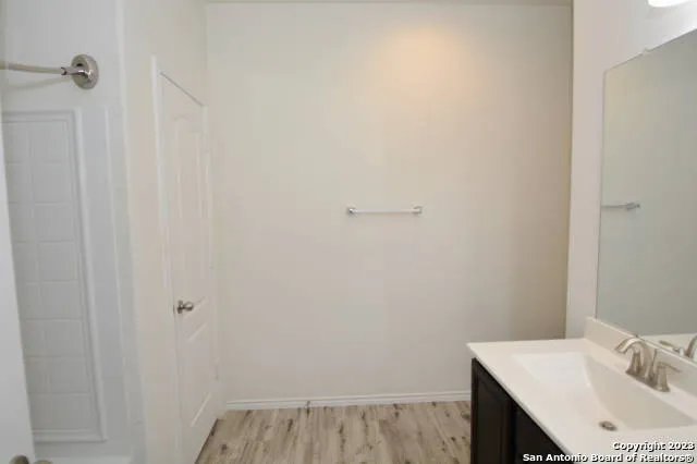a bathroom with a sink and vanity