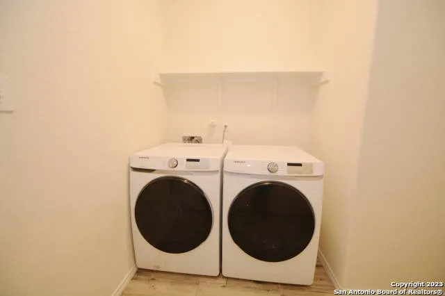 a utility room with dryer and washer