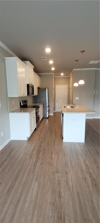 5141 Fox Den Road Oakwood, GA 30566 - Photo 12 of 29 a view of kitchen with sink microwave and cabinets