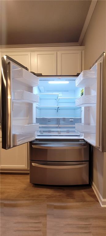 5141 Fox Den Road Oakwood, GA 30566 - Photo 14 of 29 a view of kitchen with wooden floor and cabinets