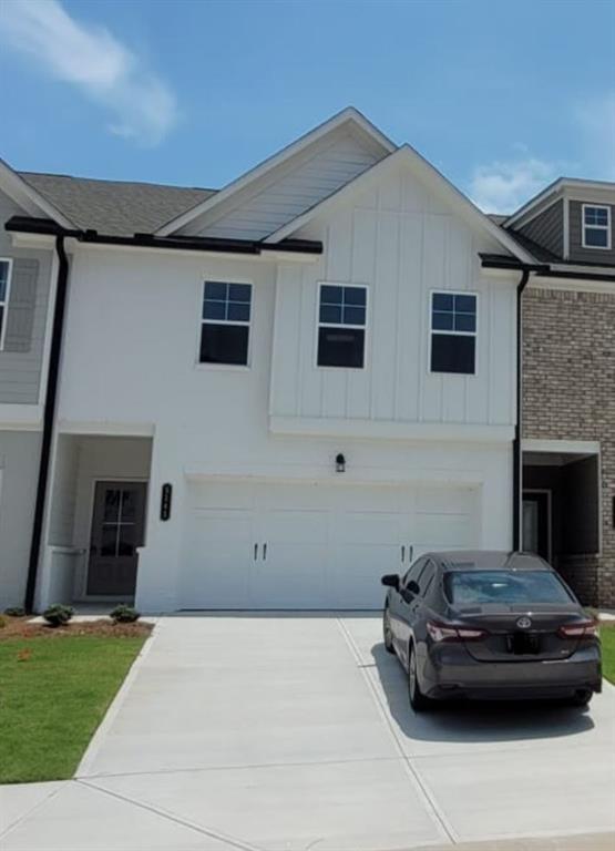 5141 Fox Den Road Oakwood, GA 30566 - Photo 2 of 29 a car parked in front of white house
