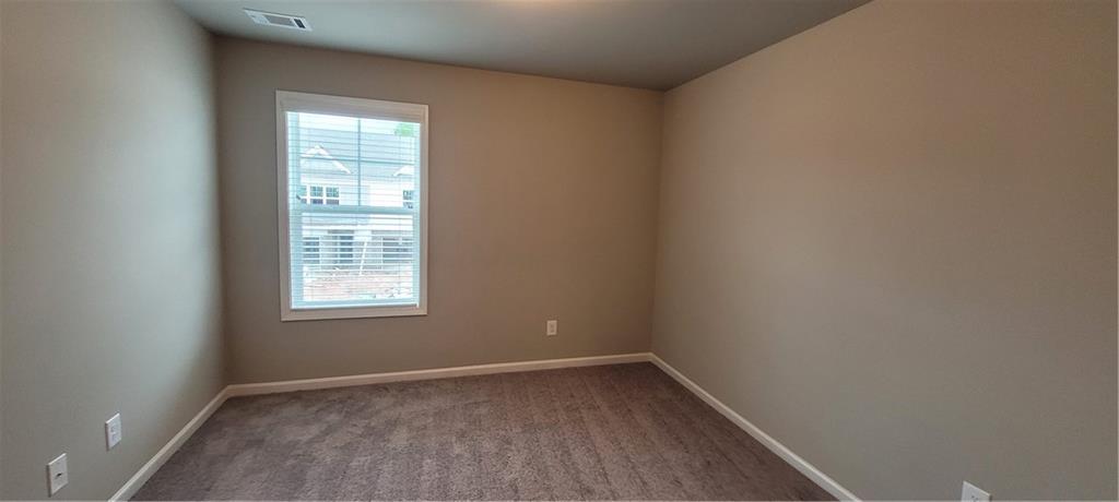 5141 Fox Den Road Oakwood, GA 30566 - Photo 27 of 29 an empty room with a window