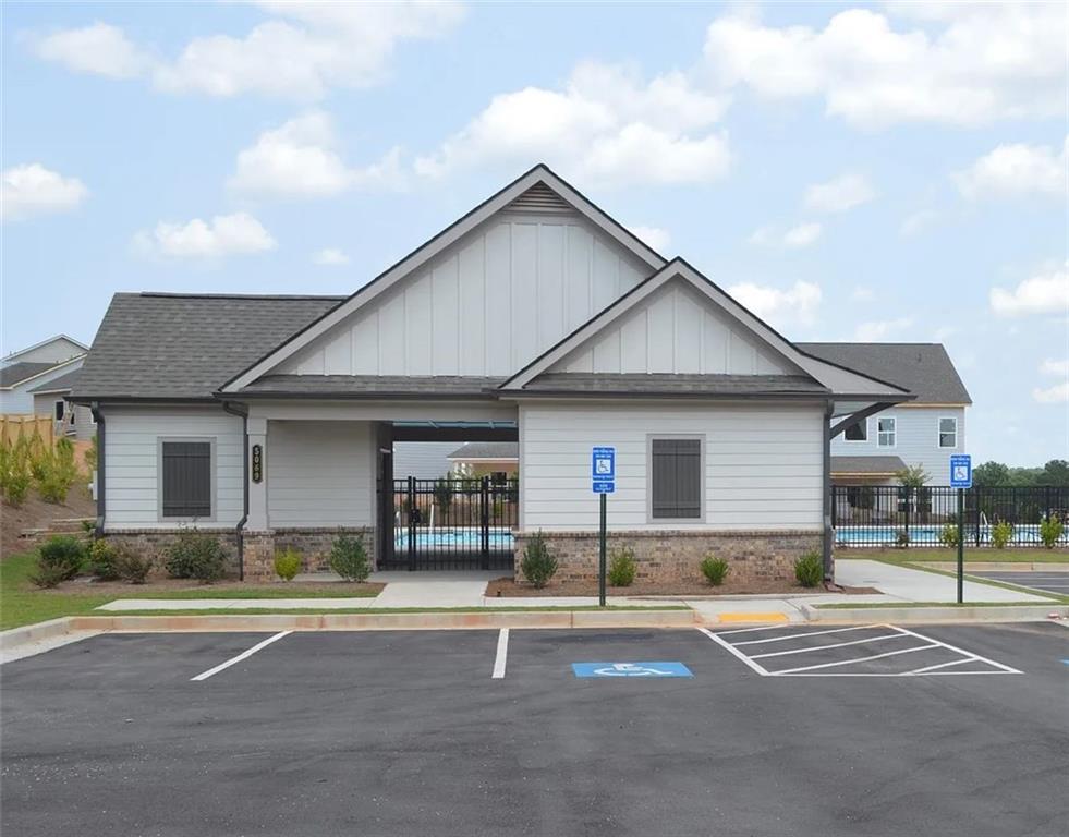 5141 Fox Den Road Oakwood, GA 30566 - Photo 28 of 29 a front view of a house with a yard and garage