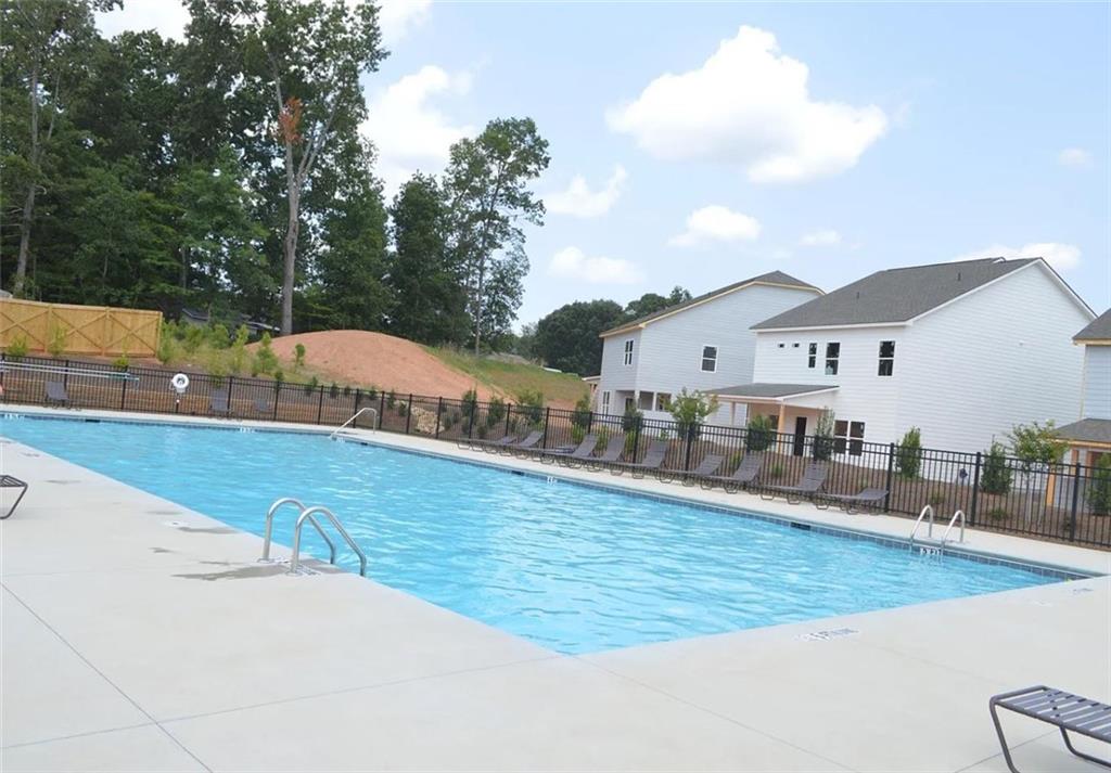 5141 Fox Den Road Oakwood, GA 30566 - Photo 29 of 29 a view of a house with swimming pool
