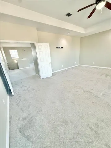 an empty room with a bathroom
