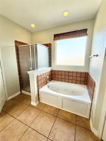 a bathroom with a bathtub and a sink