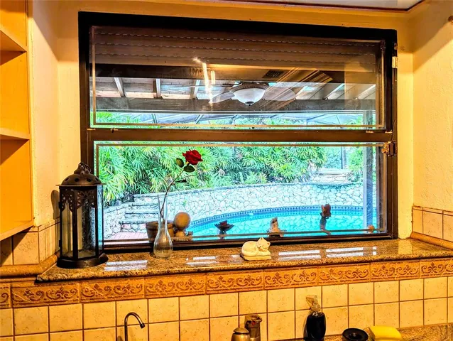 a living room with fireplace furniture and a flat screen tv
