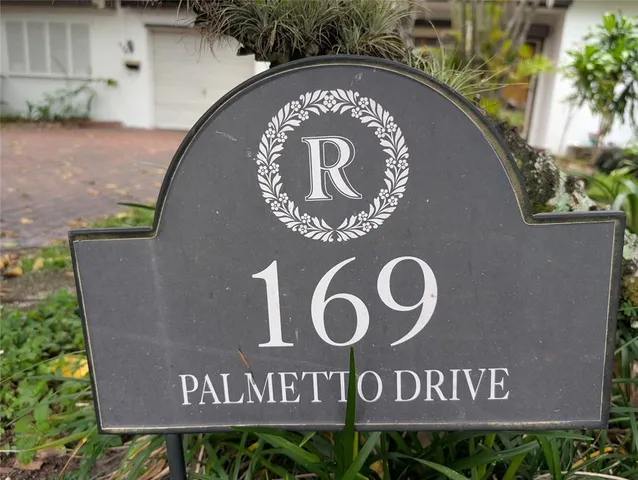 a swimming pool with outdoor seating