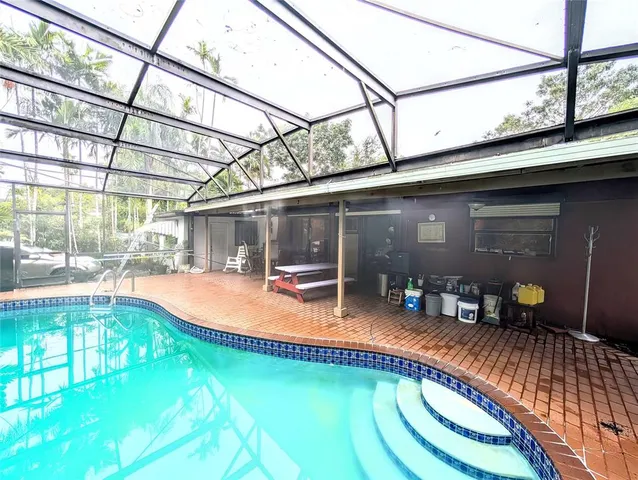 a room with furniture and large windows