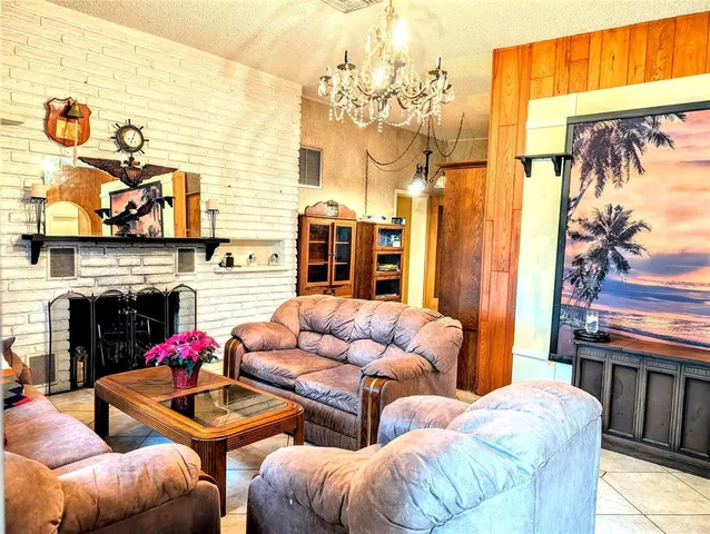 a view of a room with furniture and wooden floor
