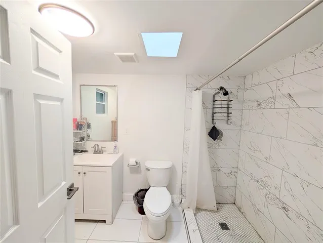 a bathroom with a shower and a shower head