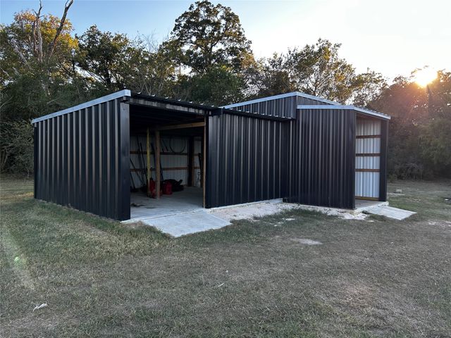 a view of a porch with wooden floor and stairs