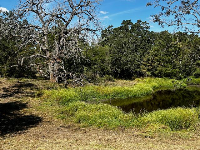 a view of a lake with a yard