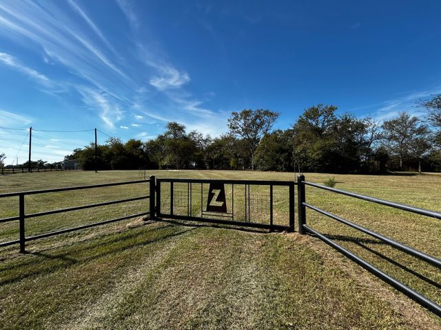 a view of a wooden fence