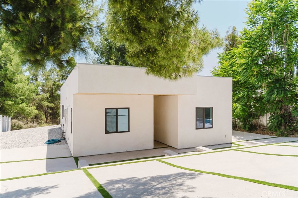 17846 Rinaldi Street Granada Hills, CA 91344 - Photo 4 of 34 a view of a house with a backyard