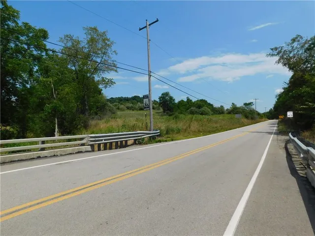 a view of a balcony with trees