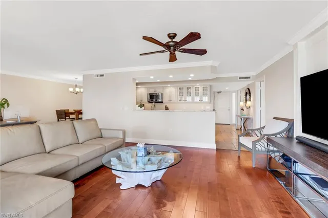 a view of a balcony with furniture and floor to ceiling window