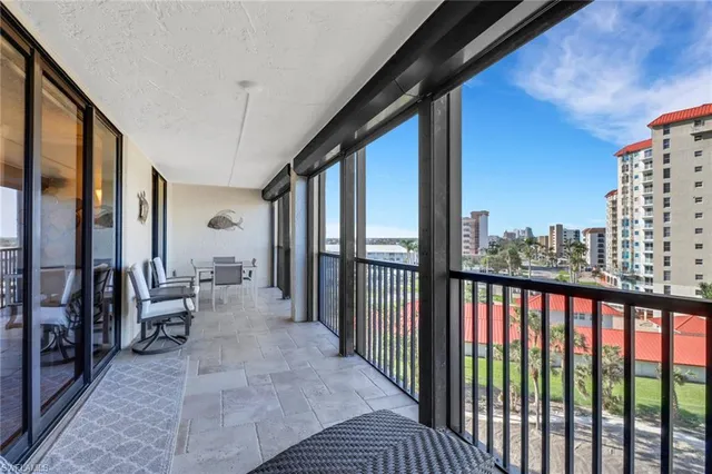 a view of living room with furniture and floor to ceiling window