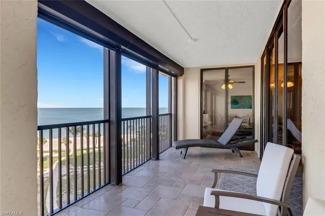 a view of a livingroom with furniture and a window