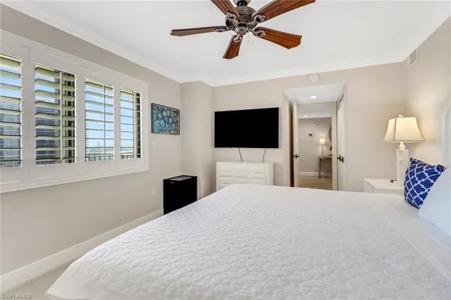 a bathroom with a granite countertop sink toilet a mirror and shower