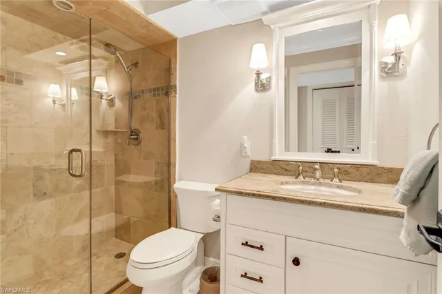 a bathroom with a shower a toilet and a sink