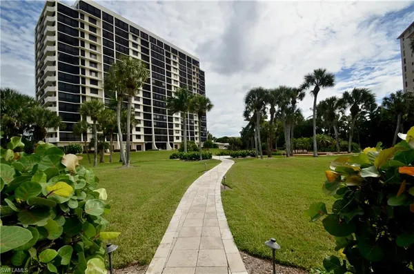 a view of a yard from a balcony