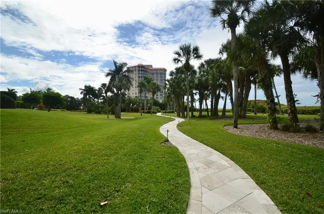 a room with lots of chairs and mirrors