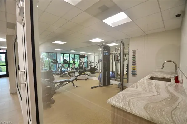 a view of building with yard and staircase