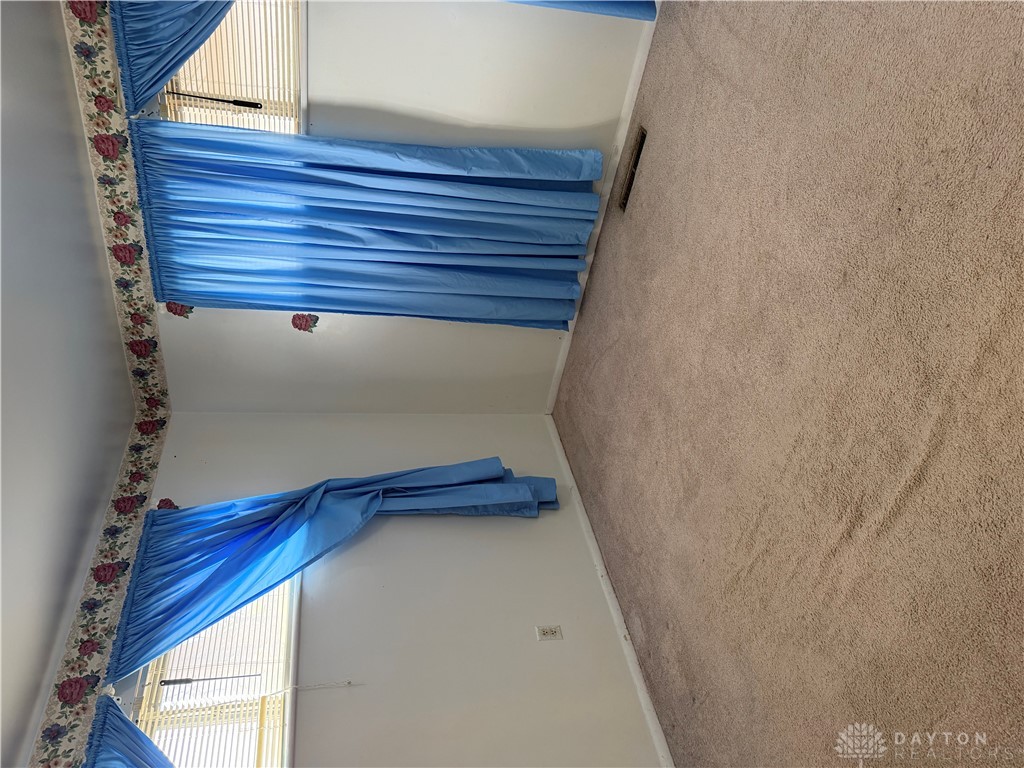 4867 Rittenhouse Drive Dayton, OH 45424 - Photo 3 of 17 This cozy bedroom features comfortable carpeting and ample natural light through well-appointed windows.