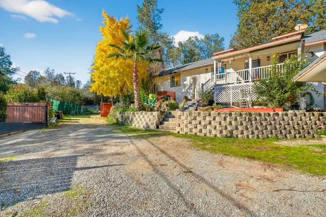 a front view of a house with a yard with garage