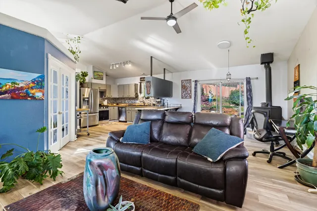 a kitchen with a sink appliances and cabinets