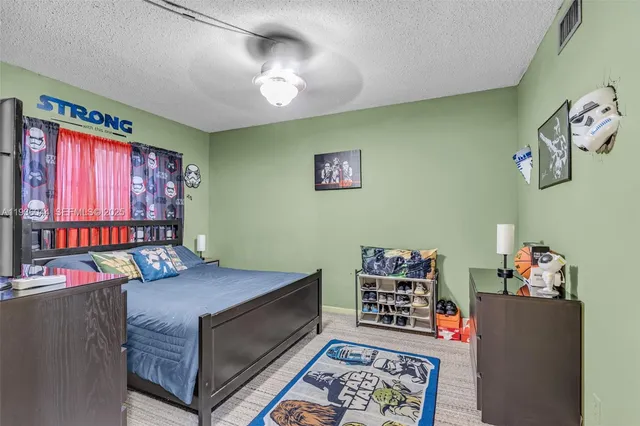 a bedroom with furniture and a window